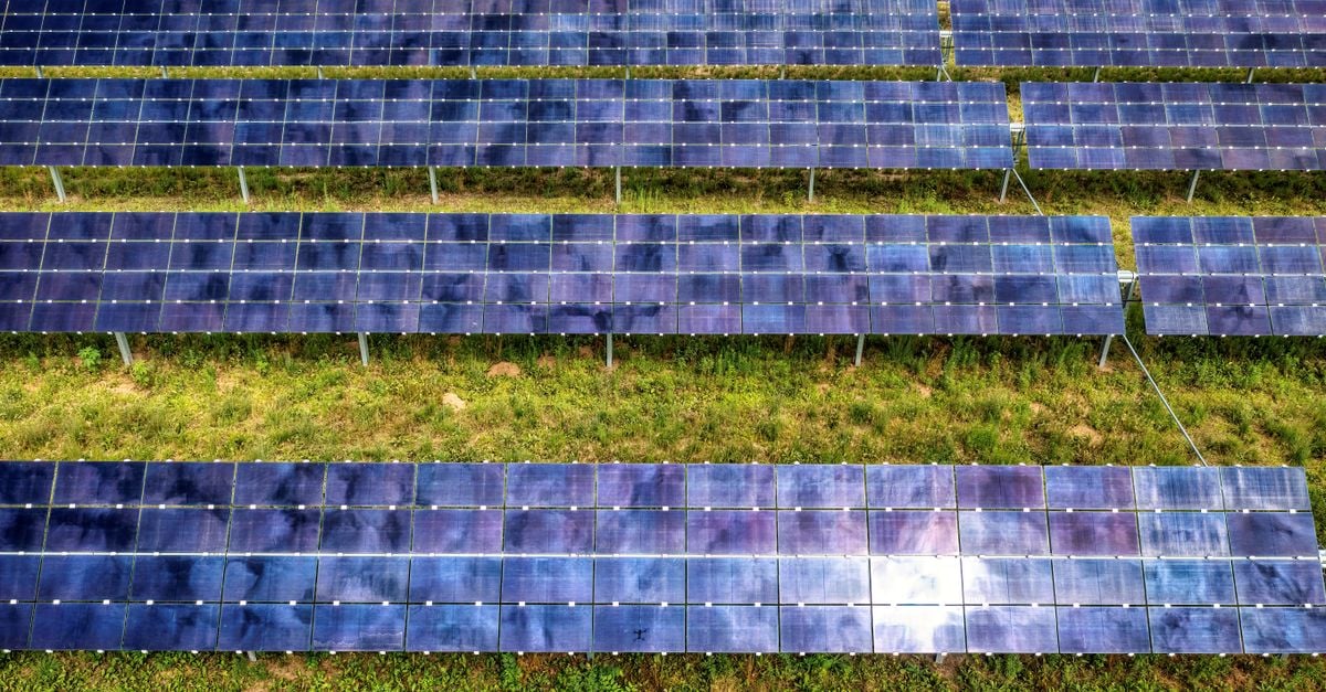 Drone shot of solar panel rows at a solar farm in Kellogg, MN, showcasing sustainable energy technology.