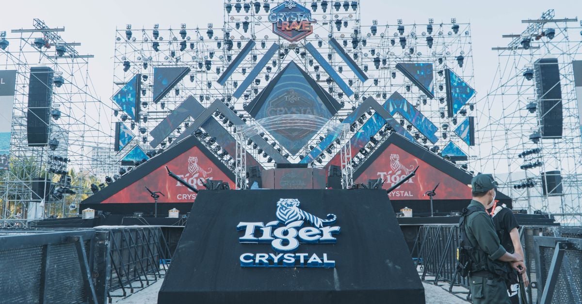 Outdoor stage setup for a major event featuring Tiger Crystal branding and structural lighting.