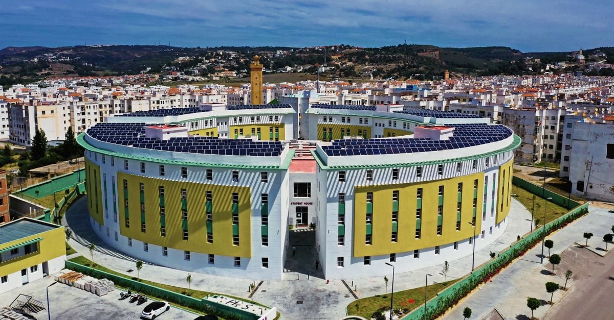 Aerial view of a solar-paneled, circular modern building in Tangier, Morocco.
