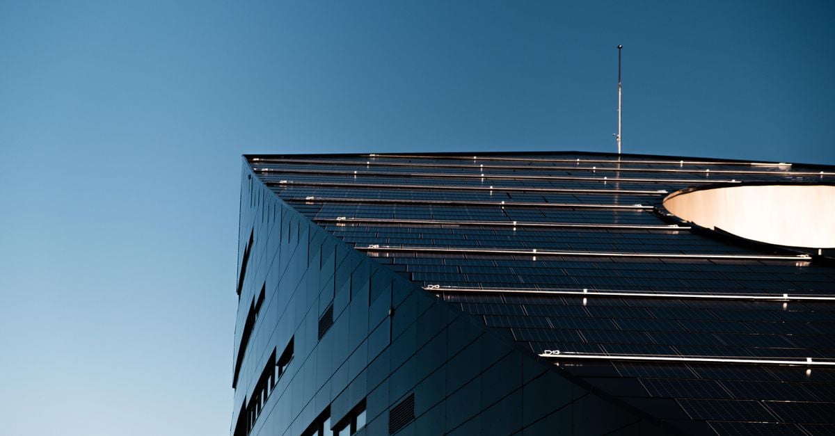 Low angle shot of a modern building with solar panels in Trondheim, Norway.
